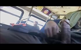 Young black stroking his cock on a bus