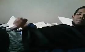 Cute black dude strokes his huge beefy cock