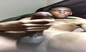 Sexy strong black stroking his fat cock
