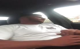 Muscular sexy young guy wanking in the car