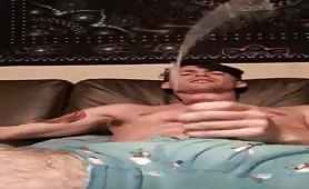 Horny surfer wanking and shooting a huge load in a bucket