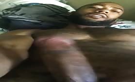 Black dude with a huge beefy cock shooting a huge load