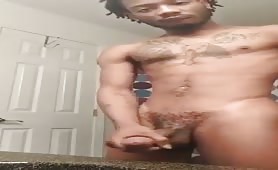 Black twink wanking his uncut cock on webcam