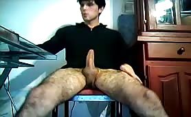 Cute young hairy twink stroking his erected cock