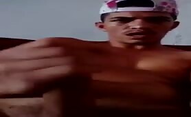 Latino thug massages his long uncut cock