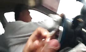 Cumming next to the taxi driver