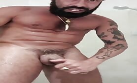 Mature bearded italian guy stroking his cock in the shower