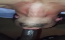 Latin dude sucking and choking on a monster black cock