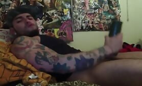 Sexy tattooed dude using his fleshlight to masturbate