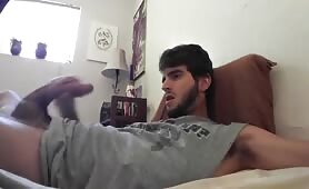 Bearded young dude strokes his cock real hard