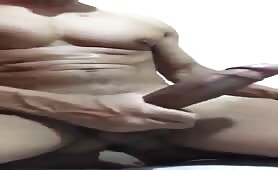 Handsome muscled Latino shows off his huge long thick cock