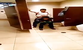 Two horny young latinos fucking in a public bathroom 