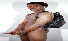 Handsome black dude with a backpack wanking his cock