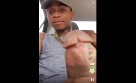 Horny black slapping his cock while he masturbates in his car