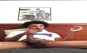 Cute young hairy black dude stroking his huge cock