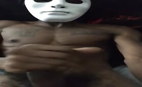 Freaky masked black guy stroking his huge beefy cock solo